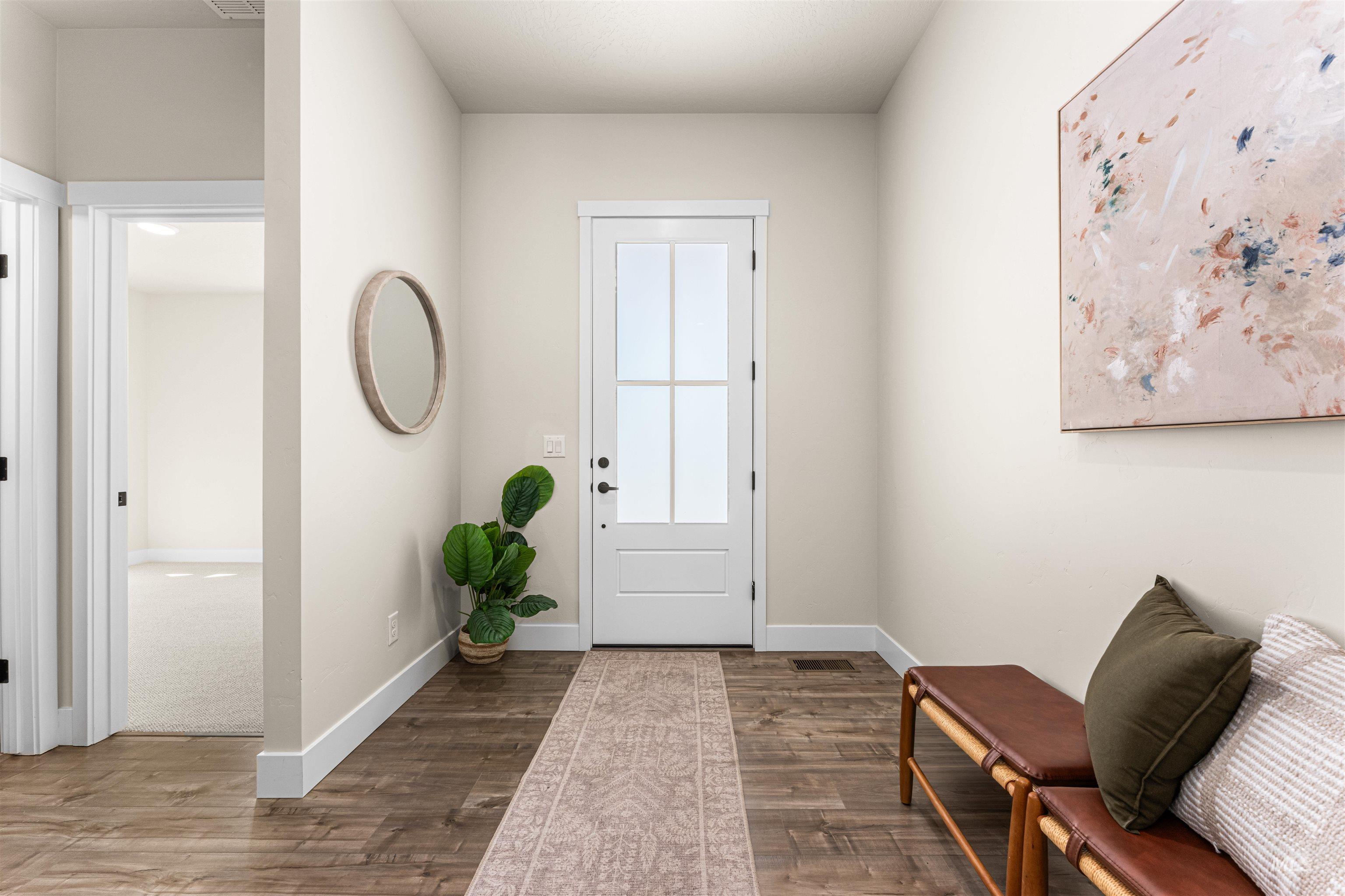 2787 West Warlander Street Meridian, ID 83642 - Photo 21 of 34 Entrance foyer with dark wood-style flooring and baseboards