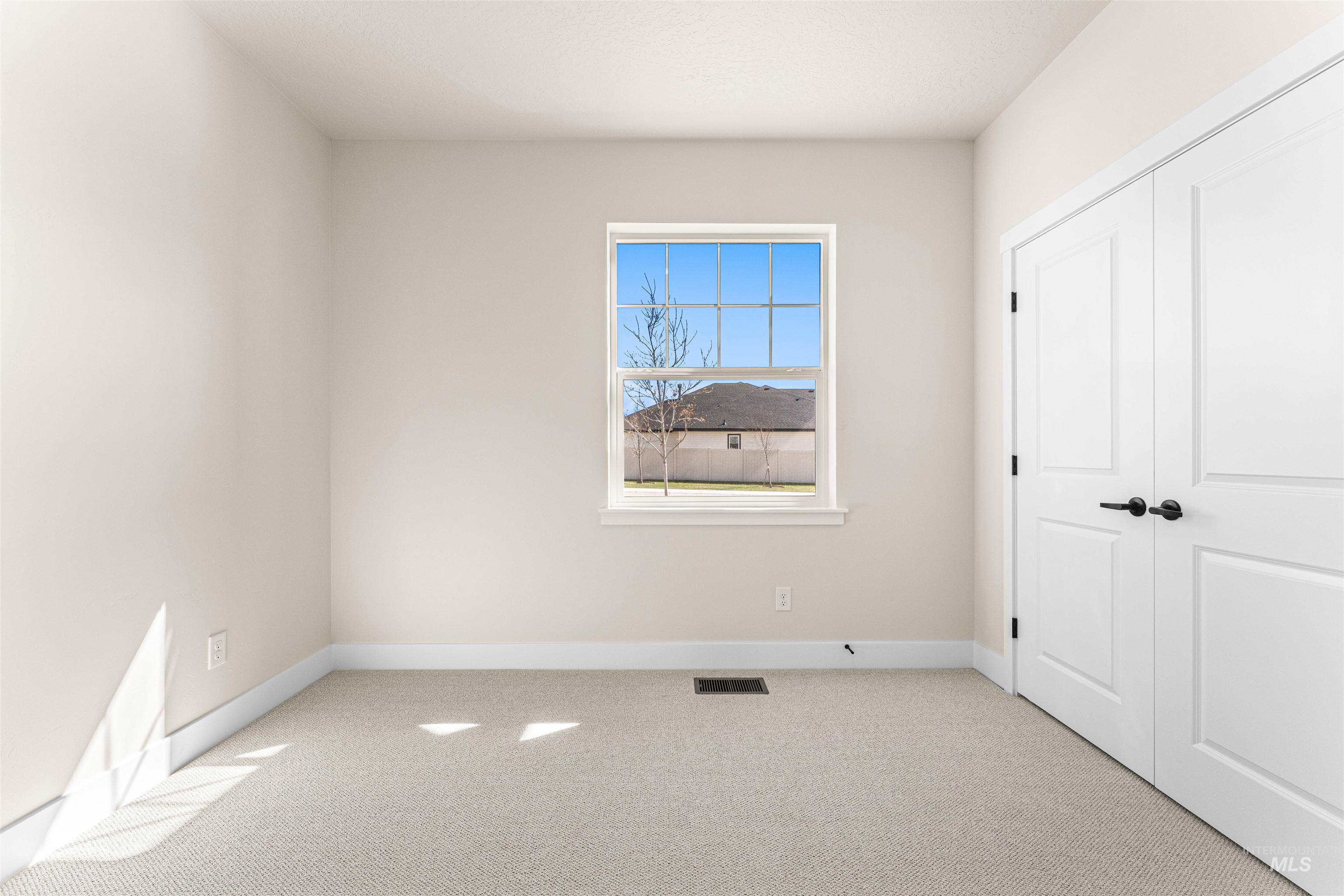 2787 West Warlander Street Meridian, ID 83642 - Photo 26 of 34 Unfurnished bedroom with light carpet and a closet