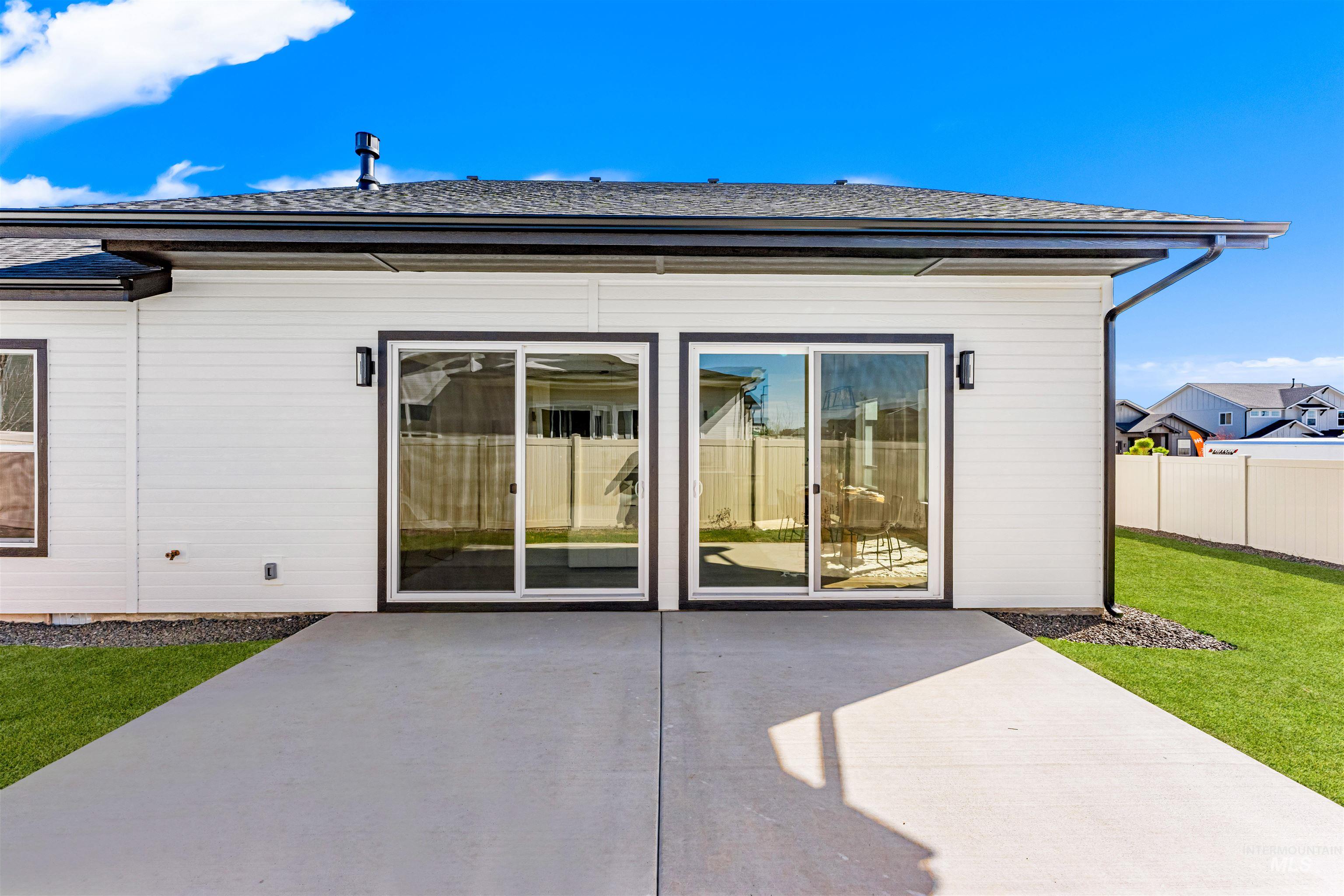 2787 West Warlander Street Meridian, ID 83642 - Photo 29 of 34 Back of property with roof with shingles and a patio area