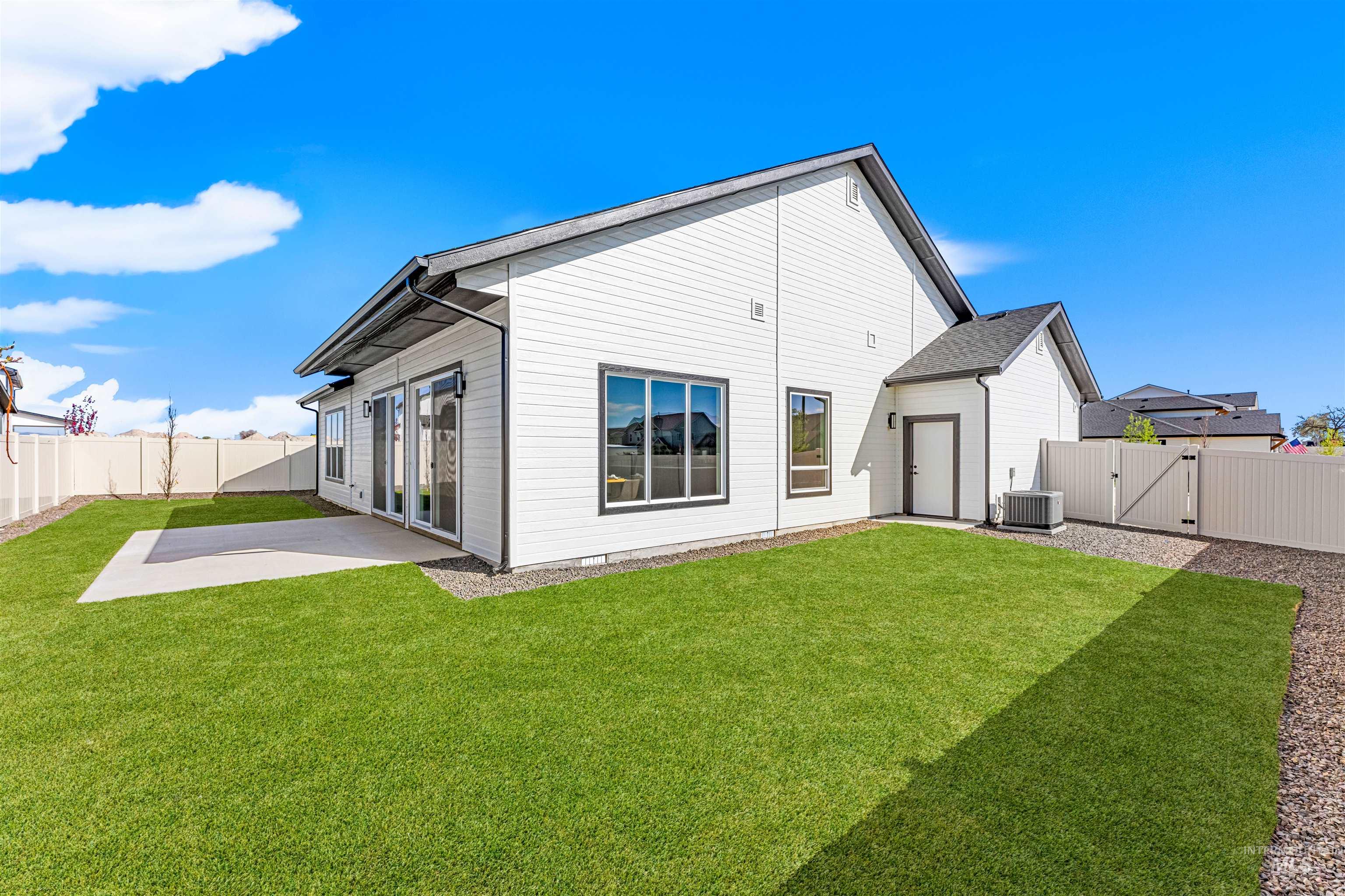 2787 West Warlander Street Meridian, ID 83642 - Photo 30 of 34 Rear view of property with a fenced backyard, a gate, and a patio