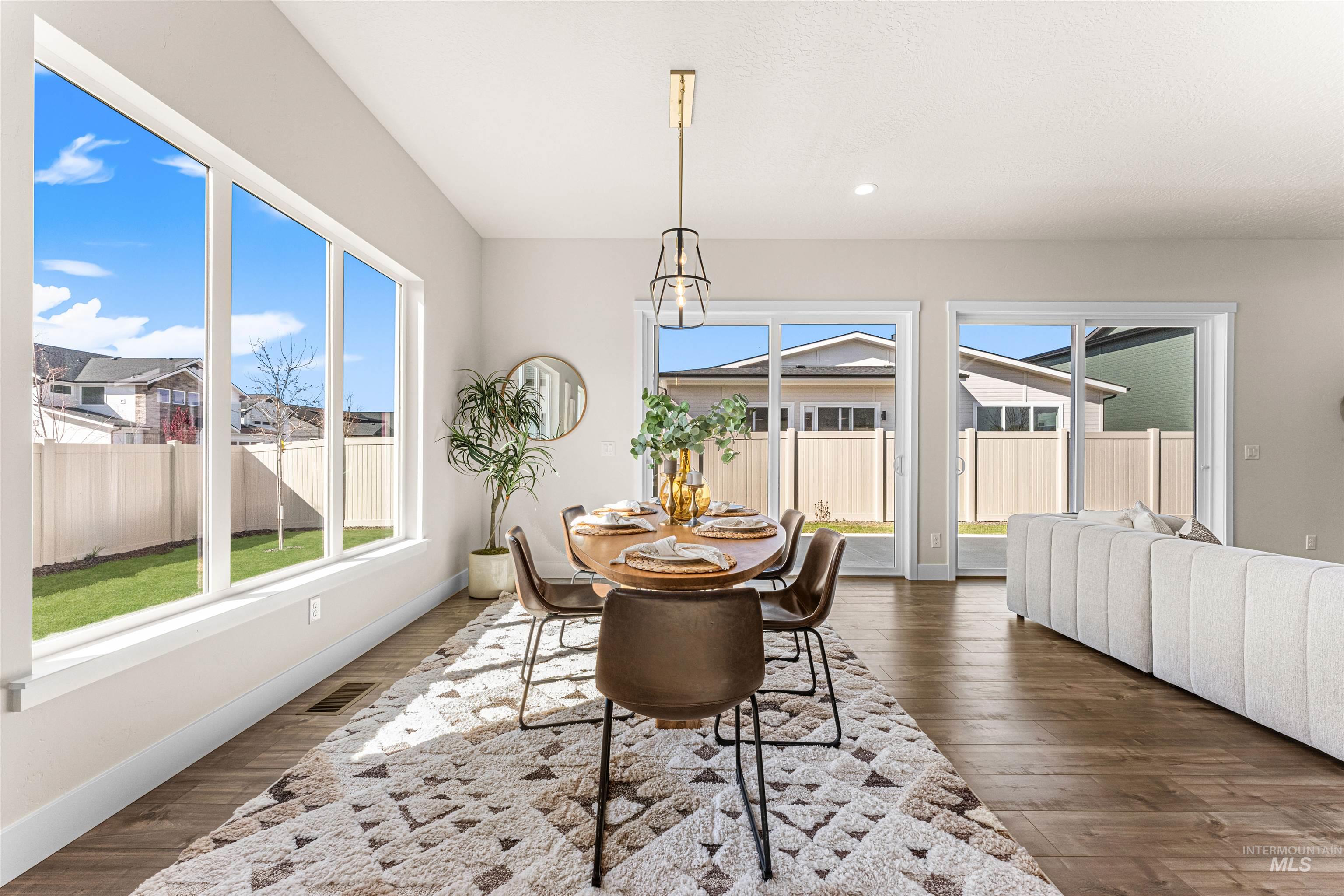 2787 West Warlander Street Meridian, ID 83642 - Photo 8 of 34 Dining area featuring dark wood-style flooring and recessed lighting