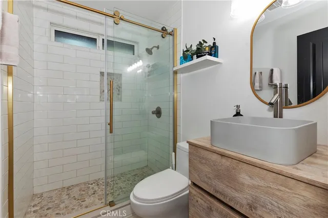 a view of a chair and table in the balcony