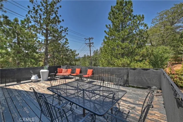 a backyard of a house with outdoor seating