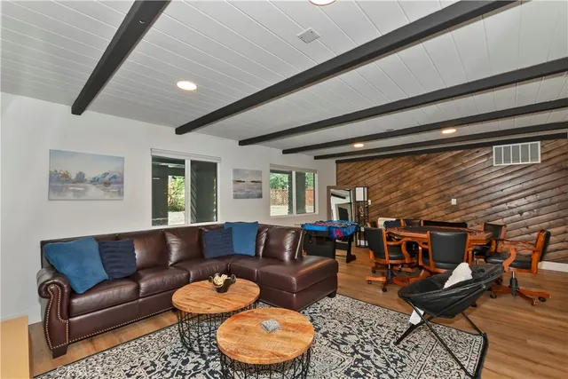 a view of a dining room with furniture and a chandelier