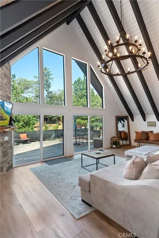a view of a house with backyard wooden floor and sitting area