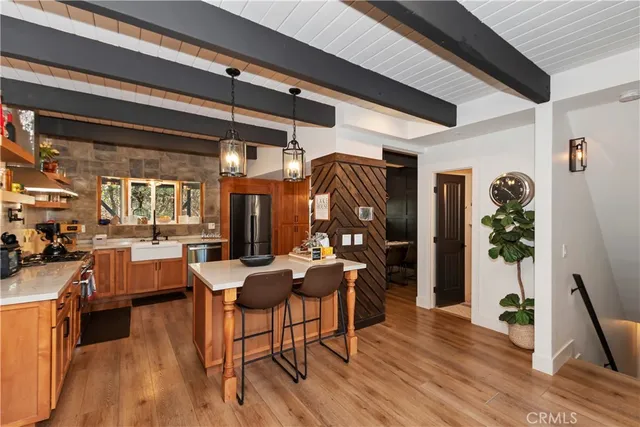 a dining room with furniture and wooden floor