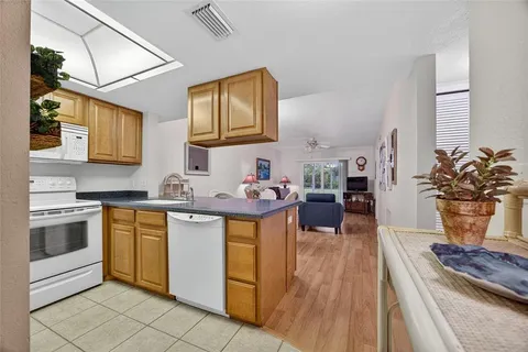 a kitchen with stainless steel appliances a stove a sink dishwasher and cabinets
