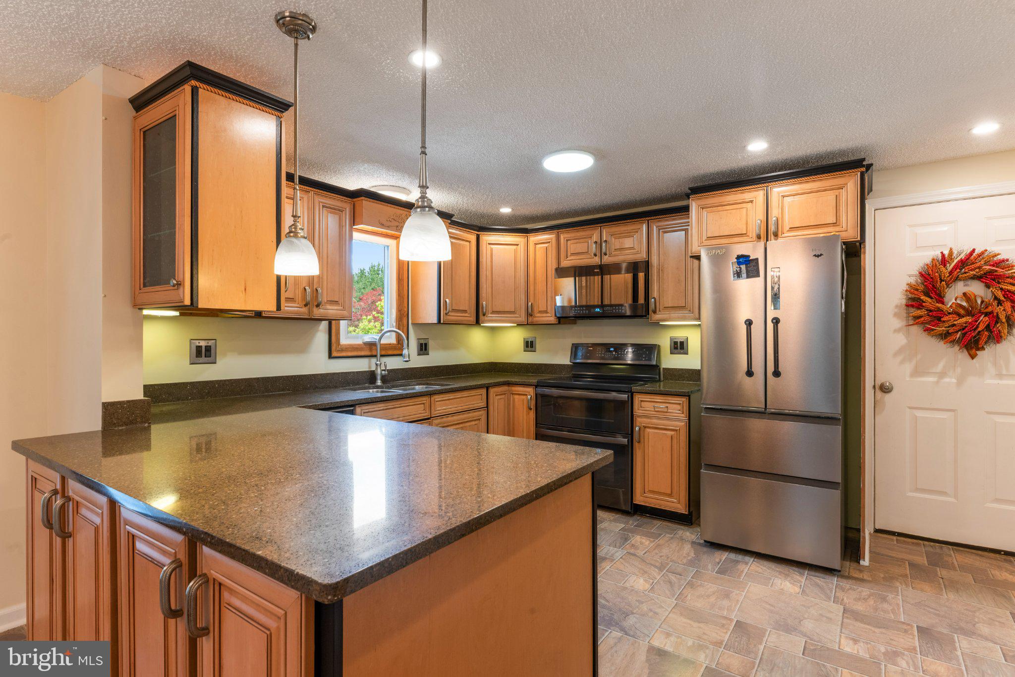 607 Chesterfield Arneytown Road Chesterfield, NJ 08515 - Photo 11 of 57 Modern kitchen with warm wood tones.