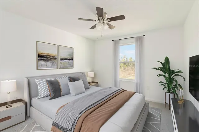 a bedroom with bed and a window