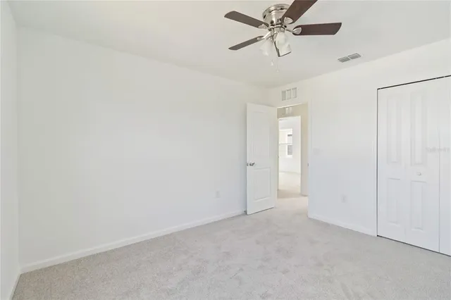 a view of a chandelier fan in a room