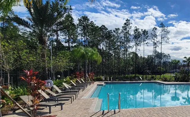a view of deck with patio and lake view