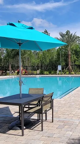 a view of a swimming pool with a lounge chairs