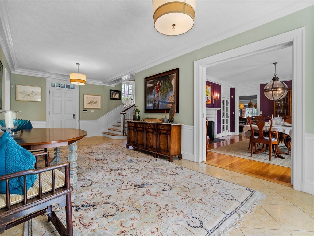 90 Burr Drive Needham, MA 02492 - Photo 17 of 41 a living room with furniture and a flat screen tv