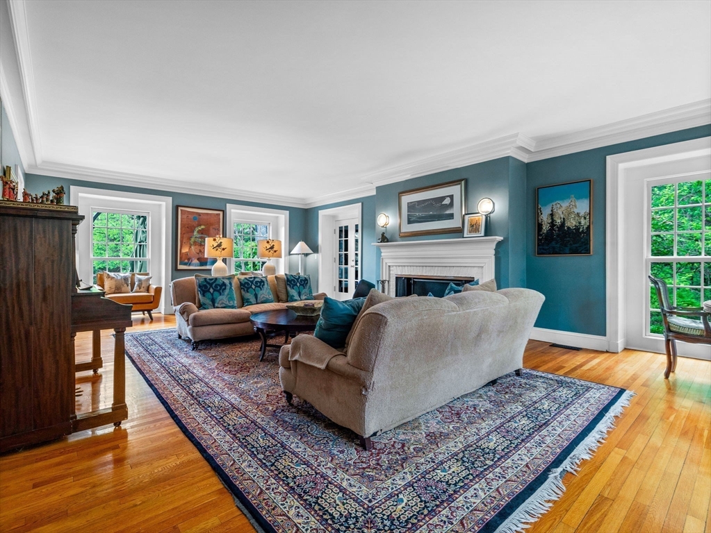 90 Burr Drive Needham, MA 02492 - Photo 18 of 41 a living room with furniture and a rug