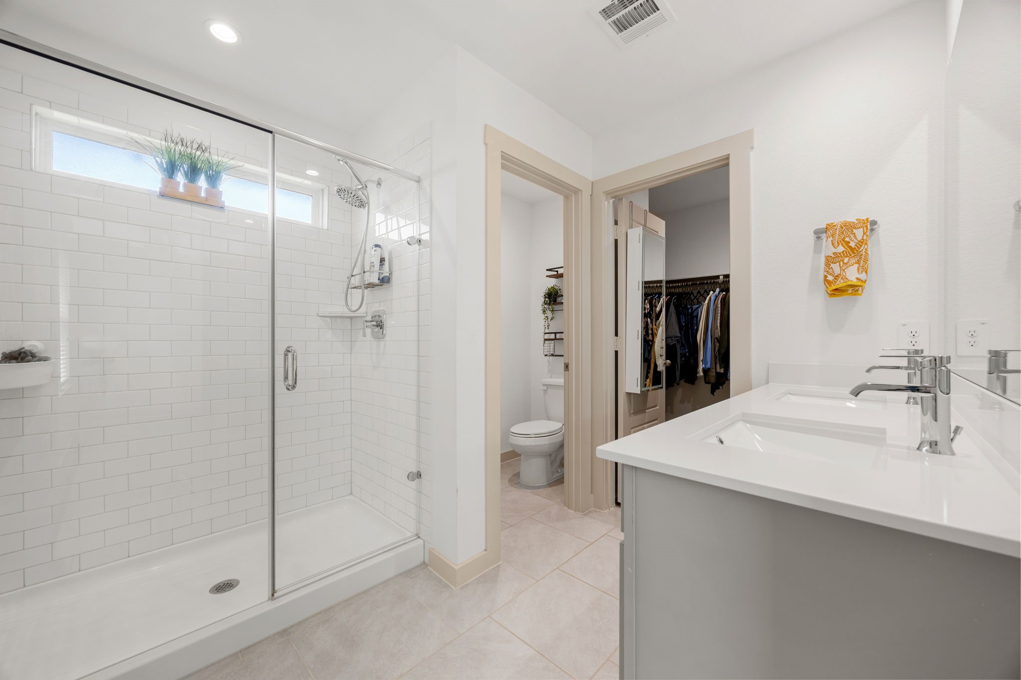 711 Alpine Fls Road Rosharon, TX 77583 - Photo 10 of 20 The centerpiece of this en-suite is the expansive walk-in shower, finished with bright, contemporary tile and high-end glass doors for a clean, open feel. With its seamless flow into a large walk-in closet, this bath offers the perfect blend of luxury and everyday convenience.