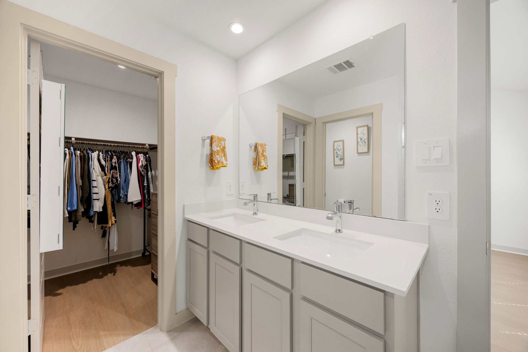 711 Alpine Fls Road Rosharon, TX 77583 - Photo 11 of 20 Indulge in the spa-inspired primary bath, designed with both style and relaxation in mind. This elegant retreat features a sleek vanity with a crisp quartz countertop and a modern undermount sink.