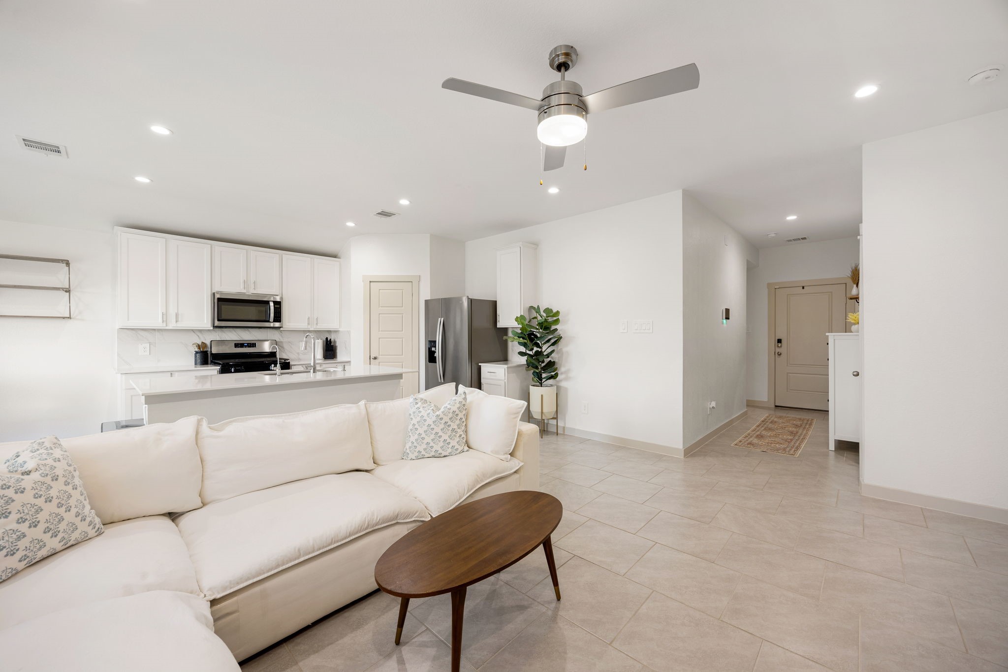 711 Alpine Fls Road Rosharon, TX 77583 - Photo 20 of 20 Seamlessly flowing into a spacious living area, this floor plan is illuminated by recessed lighting and a contemporary ceiling fan, making it the perfect setting for both relaxing and high-end entertaining.