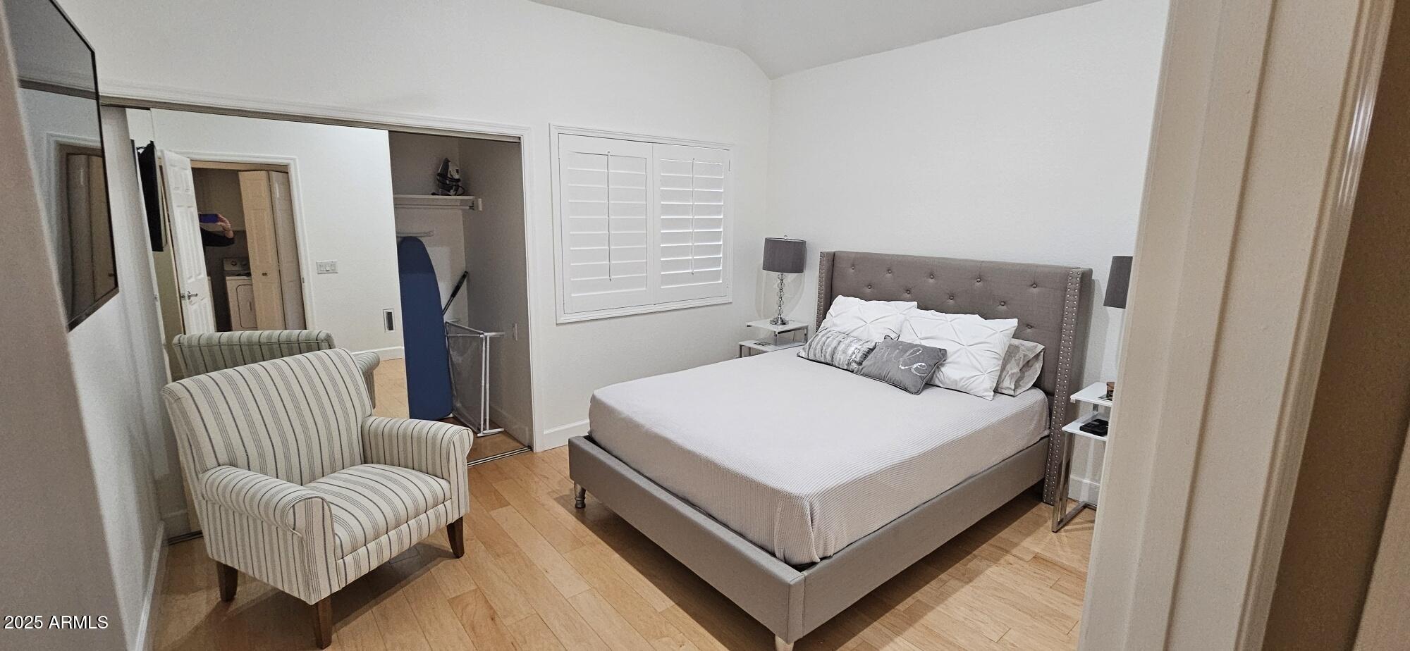 7272 East Gainey Ranch Road, Unit 120 Scottsdale, AZ 85258 - Photo 12 of 26 a bed room with a bed and a couch