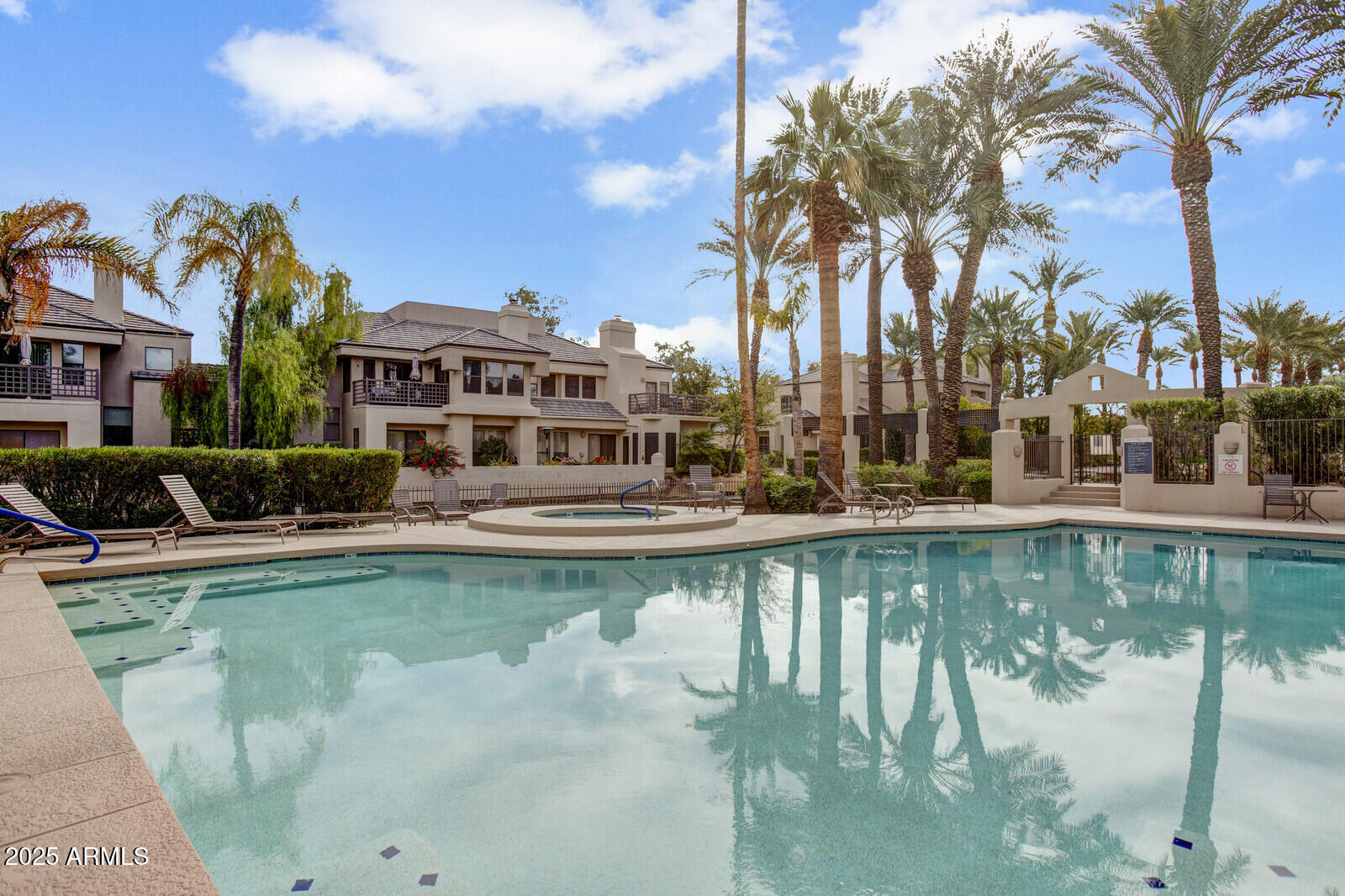 7272 East Gainey Ranch Road, Unit 120 Scottsdale, AZ 85258 - Photo 20 of 26 a view of a swimming pool with a patio