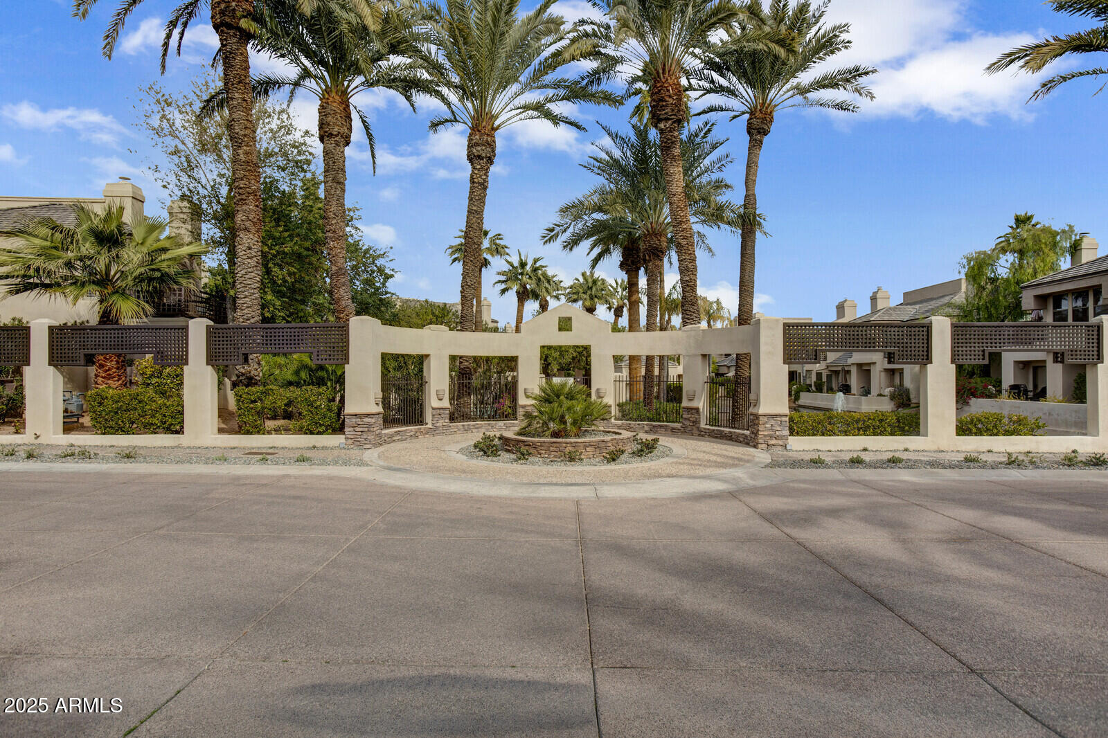 7272 East Gainey Ranch Road, Unit 120 Scottsdale, AZ 85258 - Photo 21 of 26 a view of a house with outdoor space and palm trees