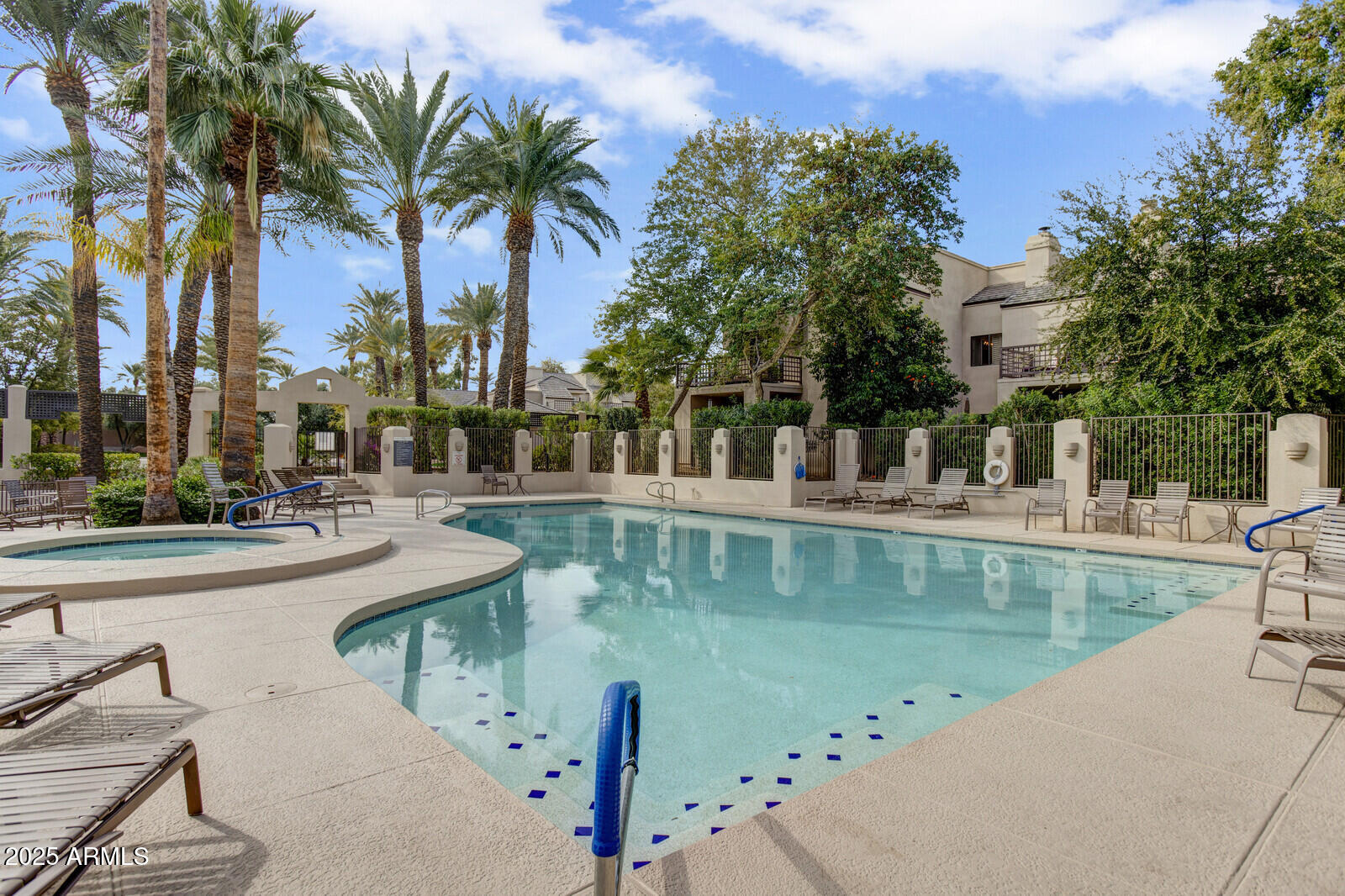 7272 East Gainey Ranch Road, Unit 120 Scottsdale, AZ 85258 - Photo 22 of 26 a view of swimming pool with a table and chairs