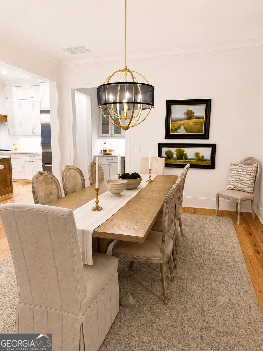 913 Indigo Bunting Road Statham, GA 30666 - Photo 7 of 31 a dining room with furniture and a chandelier