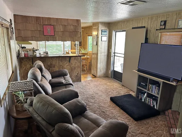 a living room with furniture and a rug