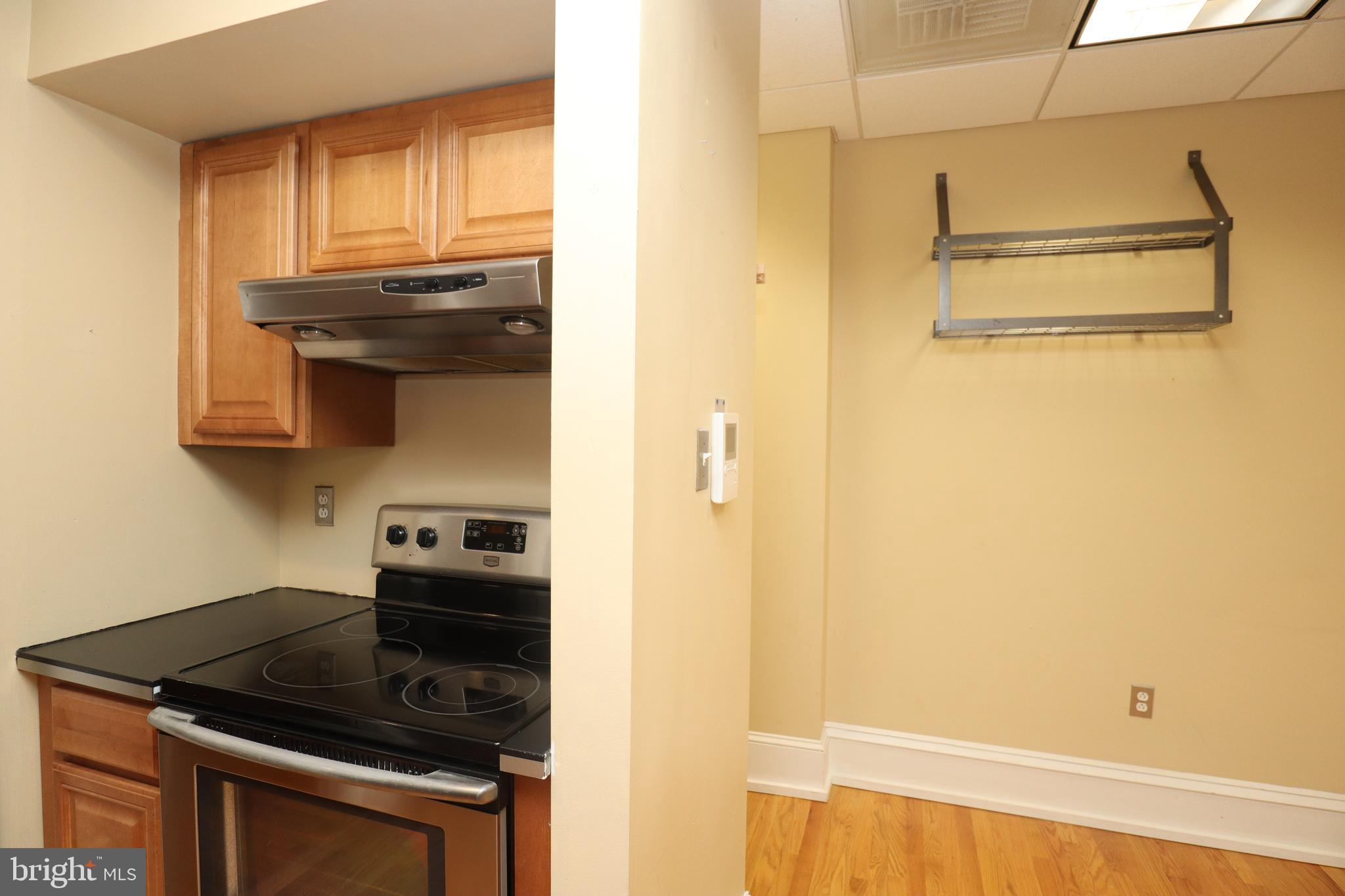1608 Spruce Street, Unit 2 Philadelphia, PA 19103 - Photo 14 of 19 a kitchen with a stove and a refrigerator