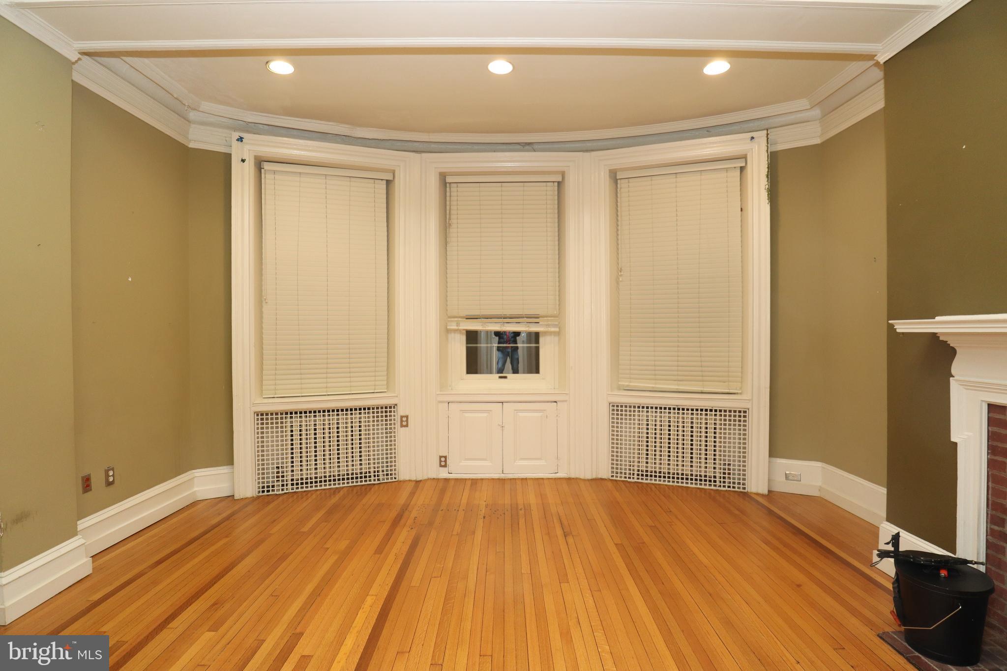 1608 Spruce Street, Unit 2 Philadelphia, PA 19103 - Photo 16 of 19 a view of empty room with wooden floor and fan