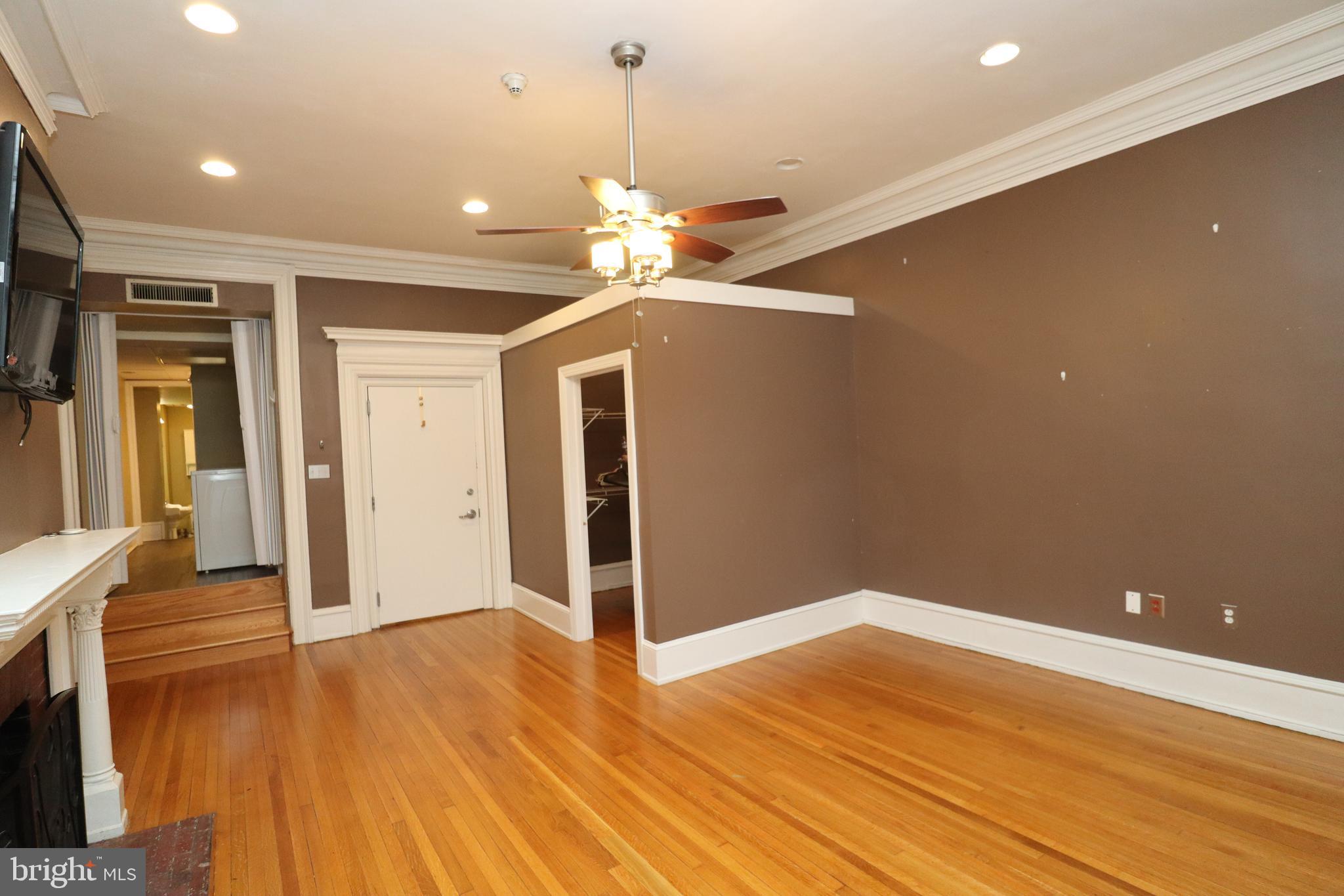 1608 Spruce Street, Unit 2 Philadelphia, PA 19103 - Photo 5 of 19 a view of a livingroom with wooden floor