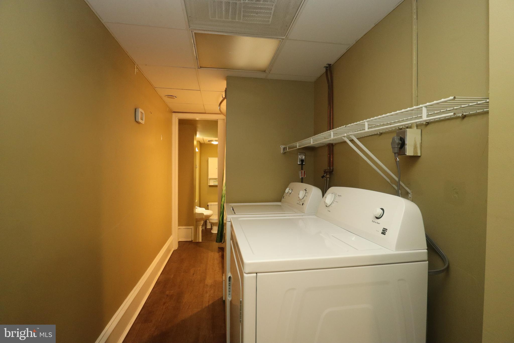 1608 Spruce Street, Unit 2 Philadelphia, PA 19103 - Photo 7 of 19 a utility room with dryer and washer