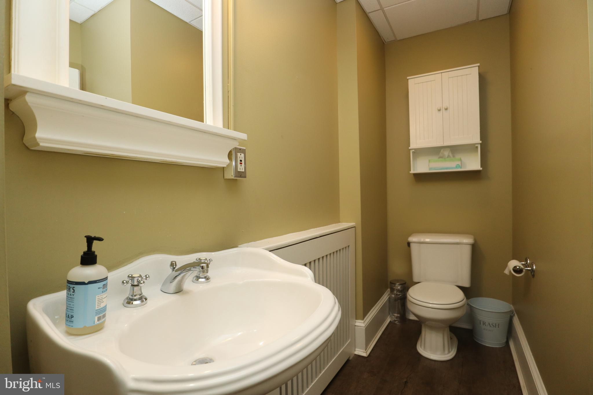 1608 Spruce Street, Unit 2 Philadelphia, PA 19103 - Photo 10 of 19 a bathroom with a toilet sink and mirror