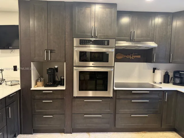 a kitchen with a stove and a microwave