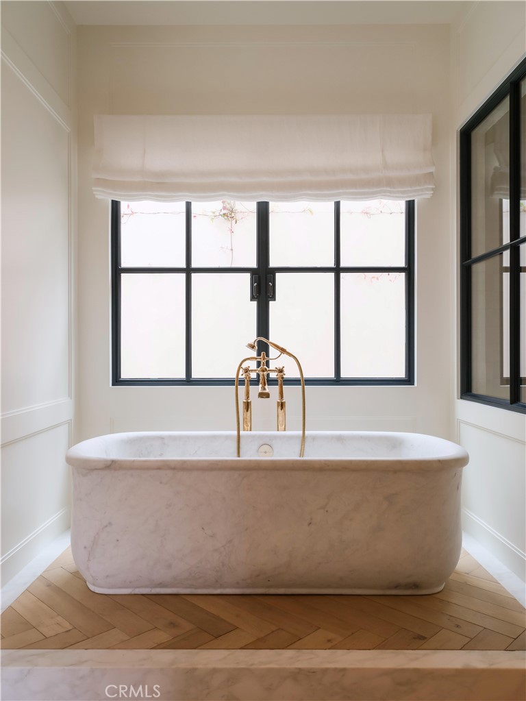 12 Burning Tree Road Newport Beach, CA 92660 - Photo 11 of 32 a white bath tub sitting next to a window