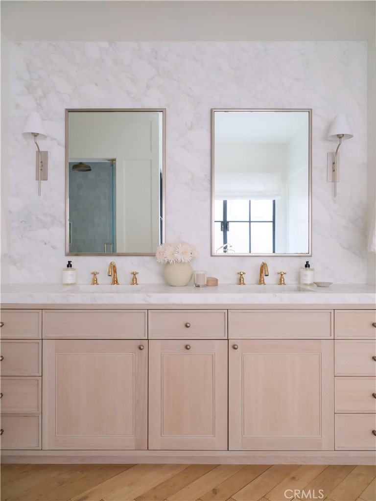 12 Burning Tree Road Newport Beach, CA 92660 - Photo 12 of 32 a bathroom with sinks mirror and vanity