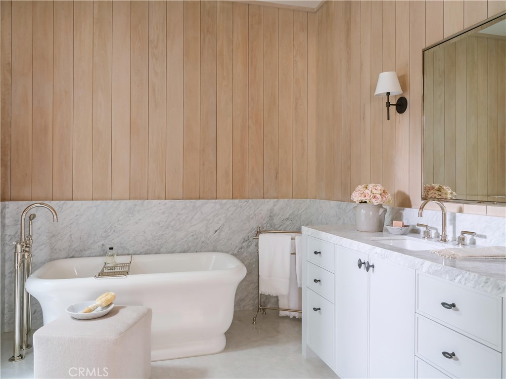 12 Burning Tree Road Newport Beach, CA 92660 - Photo 16 of 32 a bathroom with a sink and a bathtub