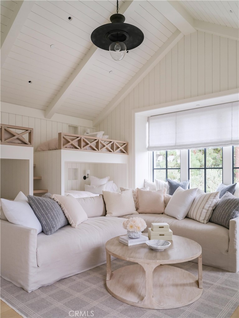 12 Burning Tree Road Newport Beach, CA 92660 - Photo 18 of 32 a living room with furniture and a large window