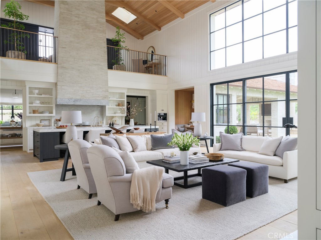 12 Burning Tree Road Newport Beach, CA 92660 - Photo 2 of 32 a living room with furniture and a large window