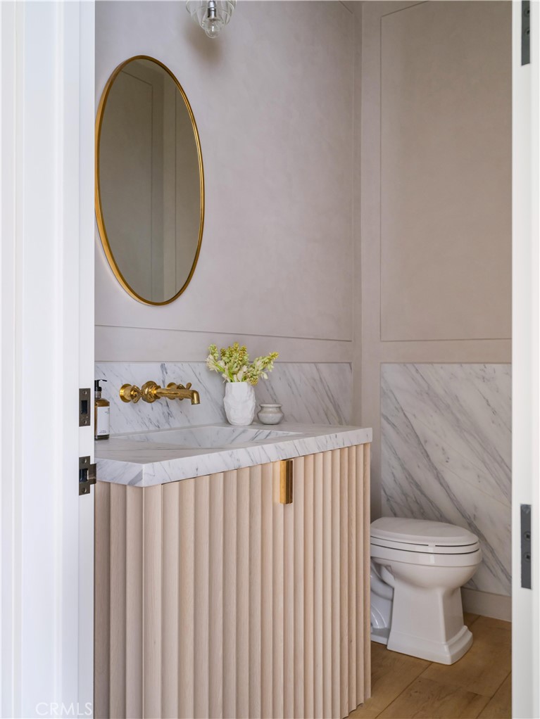 12 Burning Tree Road Newport Beach, CA 92660 - Photo 24 of 32 a bathroom with a sink and a mirror