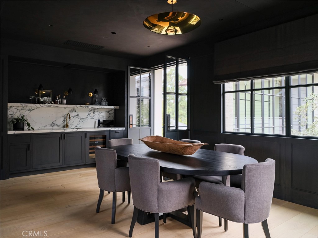 12 Burning Tree Road Newport Beach, CA 92660 - Photo 27 of 32 a view of a dining room with furniture and window