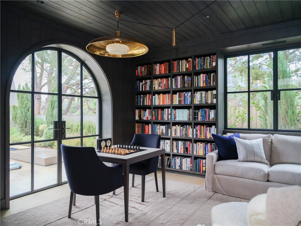 12 Burning Tree Road Newport Beach, CA 92660 - Photo 28 of 32 a living room with furniture and a large window