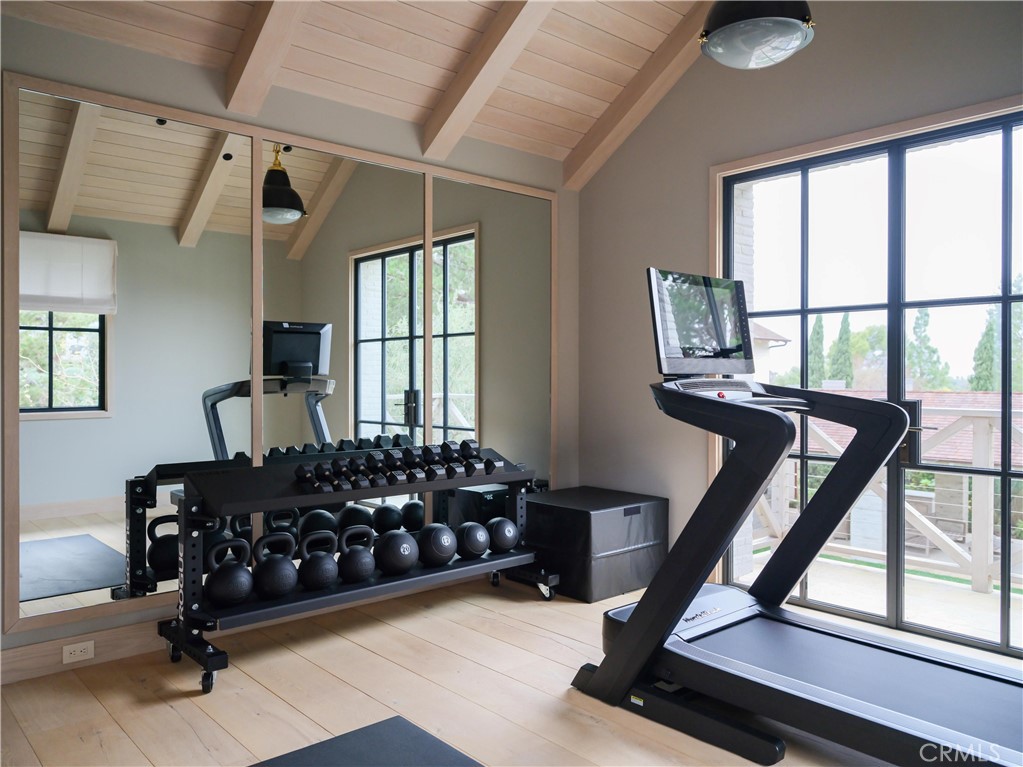 12 Burning Tree Road Newport Beach, CA 92660 - Photo 29 of 32 a bed room with furniture and a window
