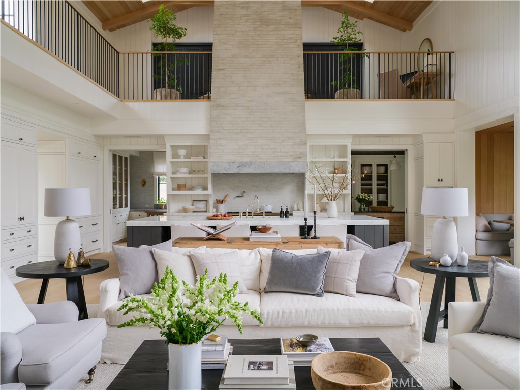 12 Burning Tree Road Newport Beach, CA 92660 - Photo 3 of 32 a living room with furniture fireplace and a potted plant