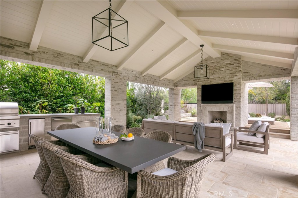 12 Burning Tree Road Newport Beach, CA 92660 - Photo 32 of 32 a outdoor dining space with furniture and garden view