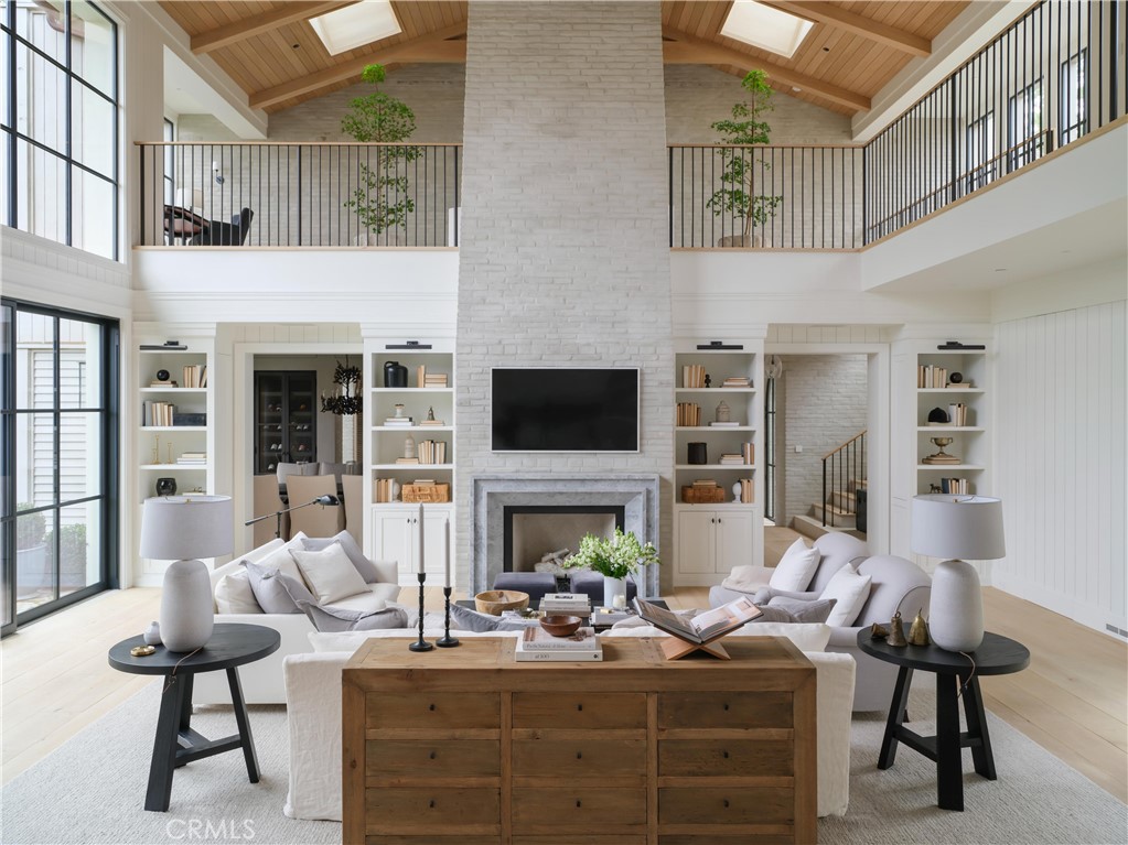 12 Burning Tree Road Newport Beach, CA 92660 - Photo 4 of 32 a living room with furniture fireplace and flat screen tv