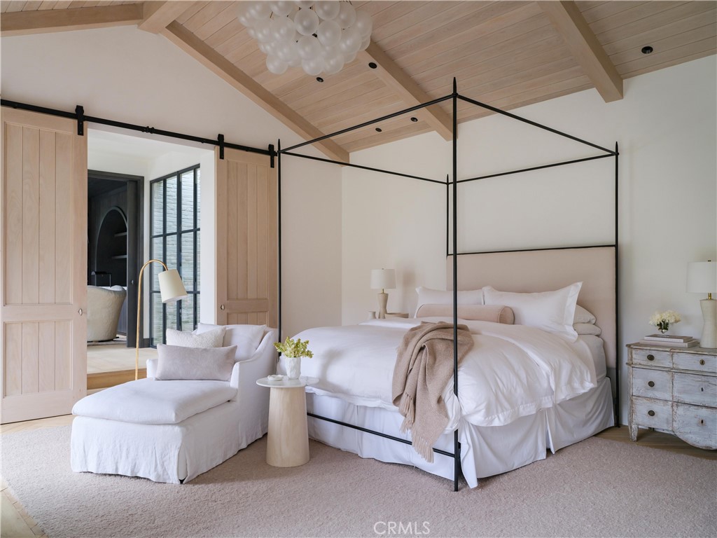 12 Burning Tree Road Newport Beach, CA 92660 - Photo 10 of 32 a bedroom with bed and a couch