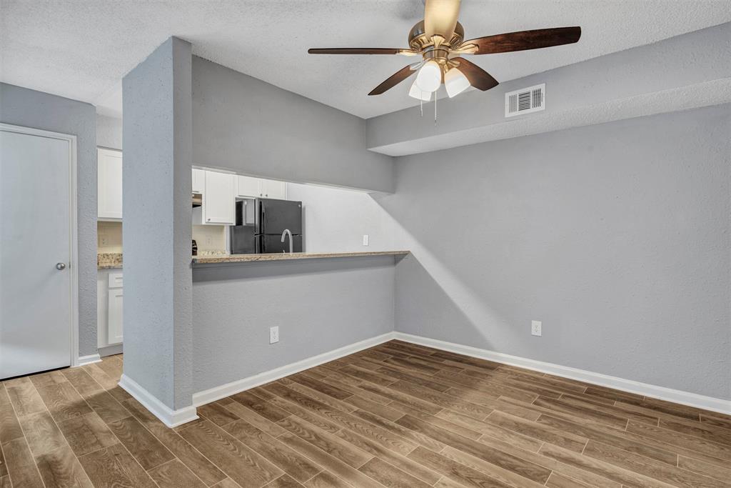 11311 Audelia Road, Unit 221 Dallas, TX 75243 - Photo 6 of 22 a view of a livingroom with an empty space