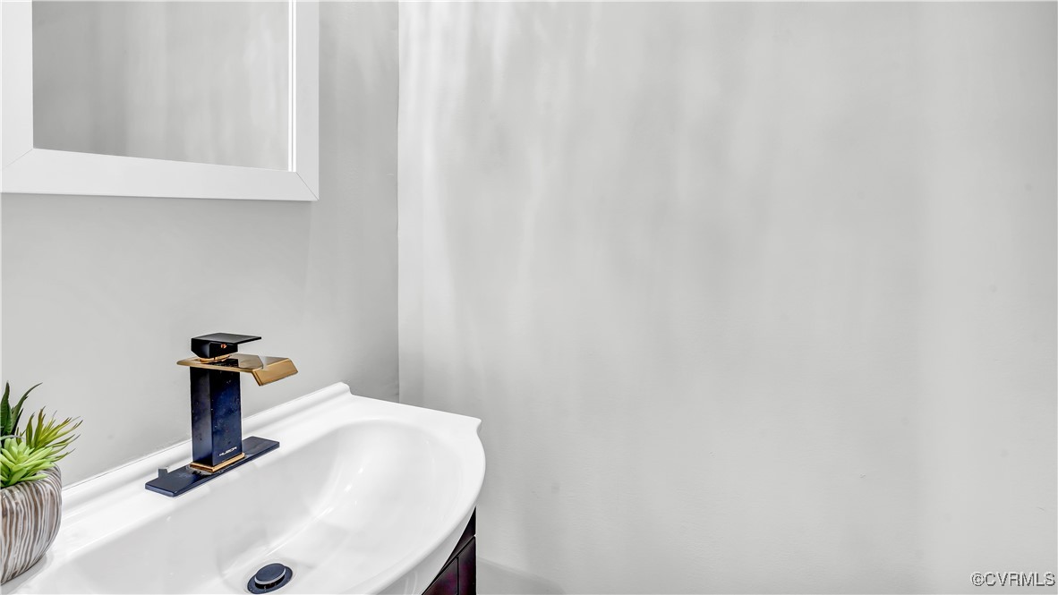 1320 Decatur Street Richmond, VA 23224 - Photo 11 of 36 a bathroom with a sink and a mirror