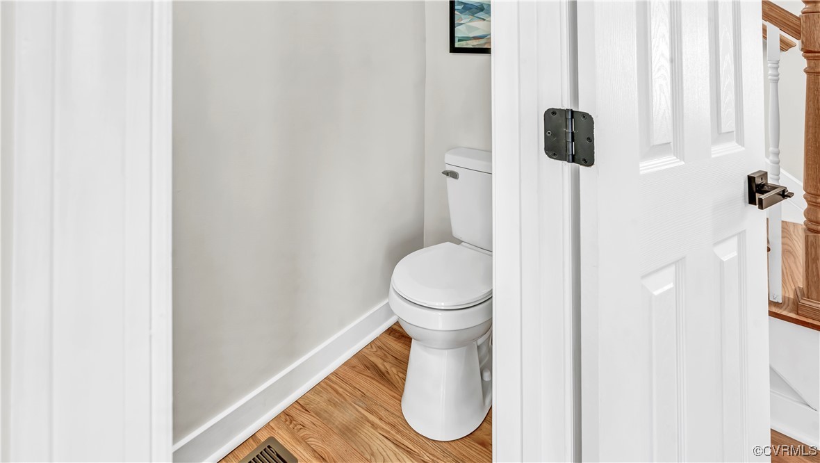 1320 Decatur Street Richmond, VA 23224 - Photo 12 of 36 a white toilet sitting next to a window