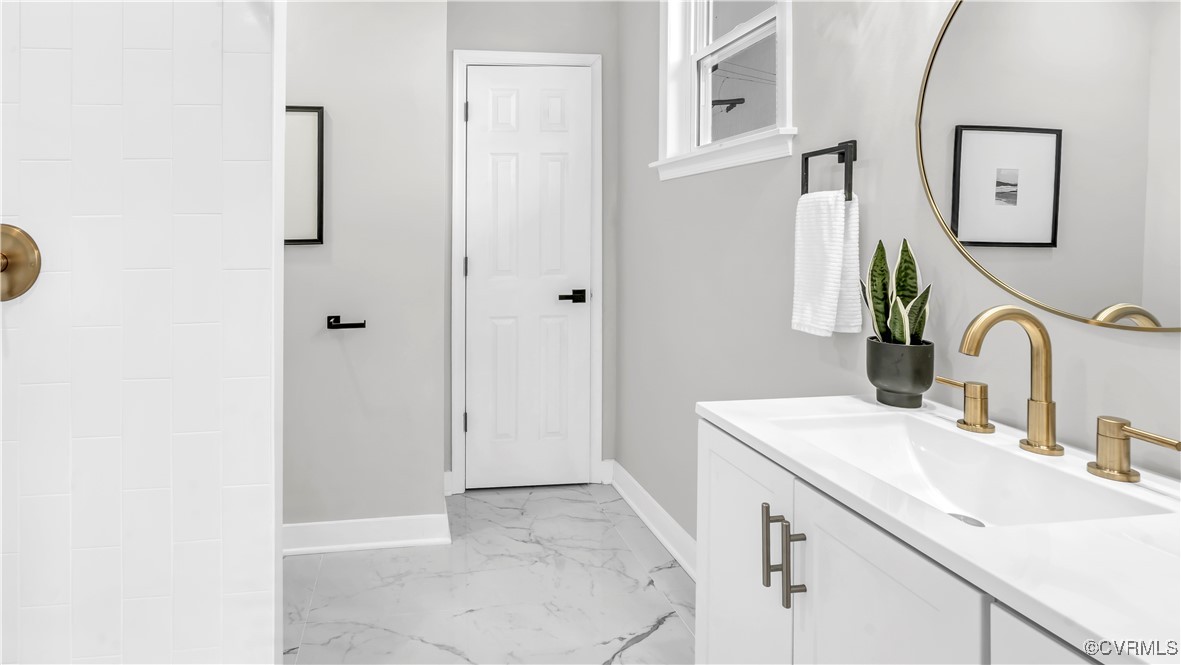 1320 Decatur Street Richmond, VA 23224 - Photo 20 of 36 a bathroom with a sink and a mirror